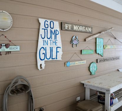 Inside the grill nook of the carport near the downstairs door