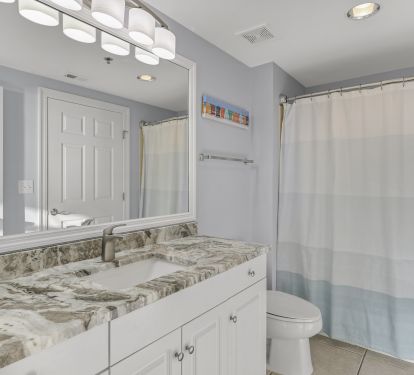 3rd bathroom with shower and tub combo.  New Granite and light