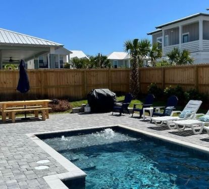 Enjoy the pool, lounge in the sun, or grill up that perfect "Cheeseburger in Paradise" on the large pavered patio at "Sunseeker"! We also include a 60" flat screen for watching the game or listening to music while outdoors!