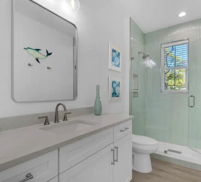 Whimsy-19 Bedroom 2 Bath. Pic 1. King with attached bath with quartz vanity and frameless glass shower