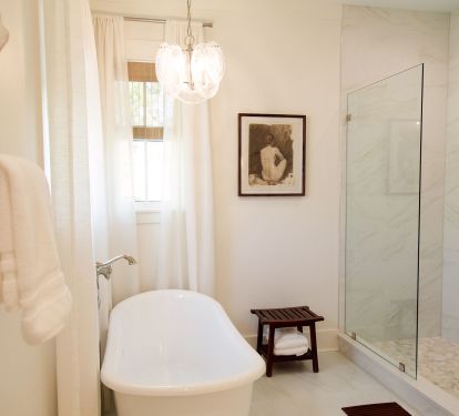 Spacious shower and luxury soaking tub complete the primary suite oasis