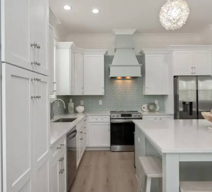 Iris-13 Create your culinary masterpieces in Iris's new kitchen, featuring stainless appliances with quartz counters.