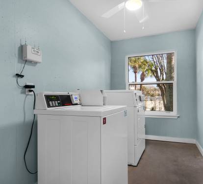 Communal coin laundry located right outside front entrance to the right.