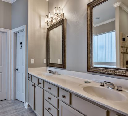 En suite 1st floor bathroom with walk-in shower &amp; Jacuzzi tub and twin vanities