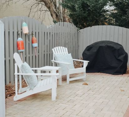 Side porch with propane grill to share plus wagon for beach items