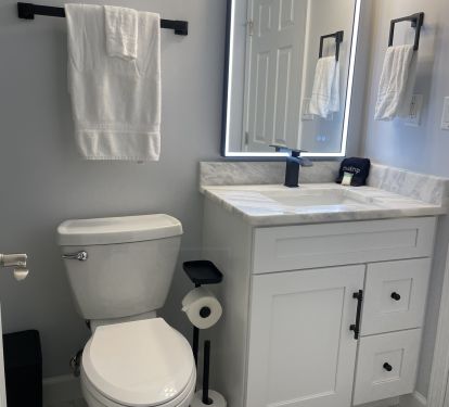 The second full bath is accessible from the front bedroom and the hallway.  