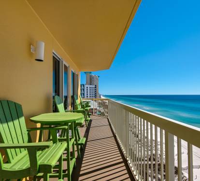 Large Beach Front private balcony with 6 chairs and a table.