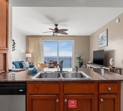 Kitchen showing the living room and balcony