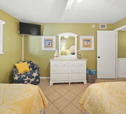 Back bedroom has two full beds along with 32 inch TV