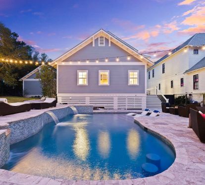 Swim up bar seats and waterfalls in the pool