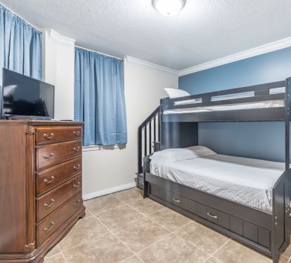 The first bedroom sleeps four. There is a bunk bed plus trundle on the bottom.
