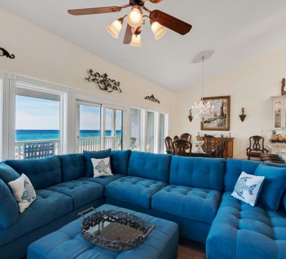 View from family room into dining room showing large, very comfortable sectional