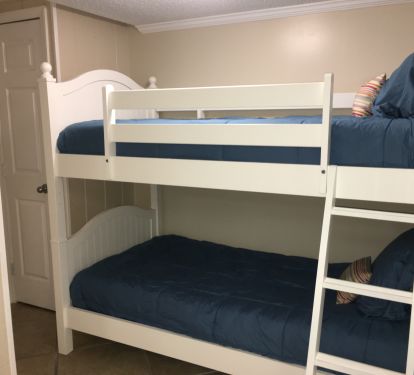 Bunk area with twin beds and closet.