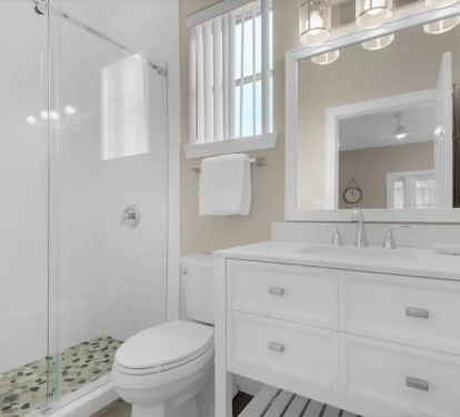 Sunkissed-18 1st floor. Bed 1, Private bath with frameless glass, tiled shower.