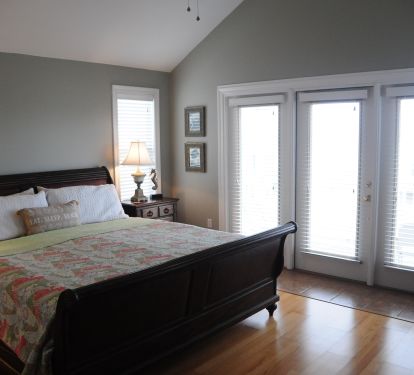 The king bed in the upstairs master bedroom
