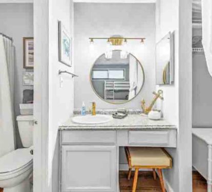 Upstairs bathroom with shower/tub combo and vanity