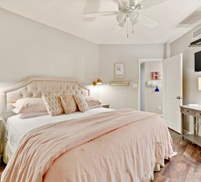 Calm pallet helps get you in vacation mode in this king bedroom