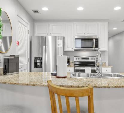 Kitchen: Modern appliances and sleek countertops await your culinary adventures!
