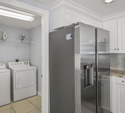 Full size iLaundry Room with iron and ironing board