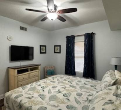The second bedroom has a king size bed.