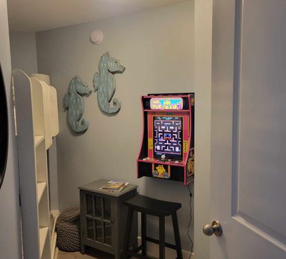 Enclosed bunk room with only arcade game at Waterscape!