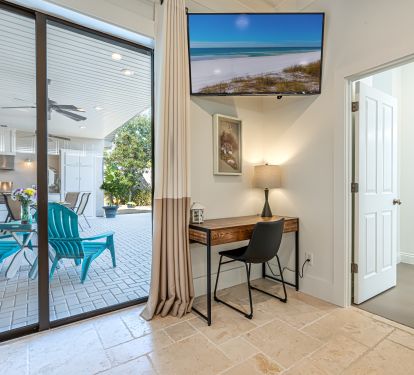 Primary Bedroom with Large Windows and Smart TV