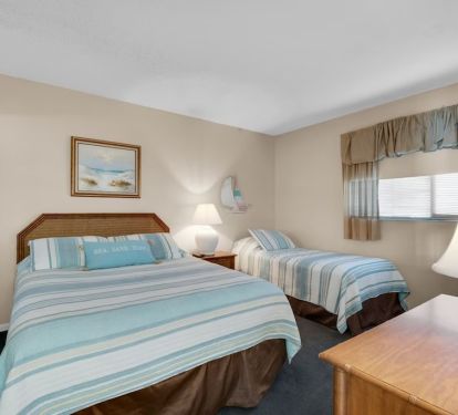 Second bedroom with queen and twin beds