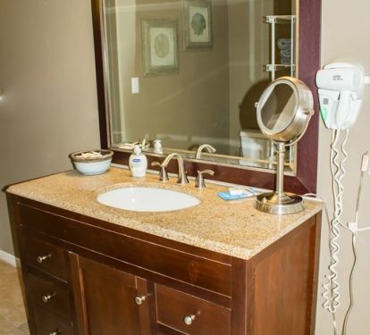 Bathroom with plenty of mirrors and built in hairdryer 