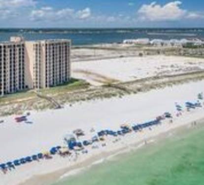 Beach with white sand emerald waters.2 chairs &amp;umbrella included with rental.