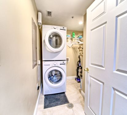 Utility Room with Large stackable LG Washer and Dryer