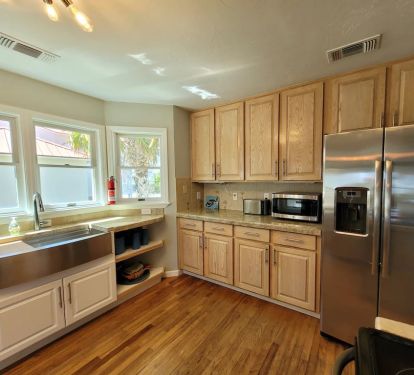 Side by side full size refrigerator/freezer with water and ice dispenser. 