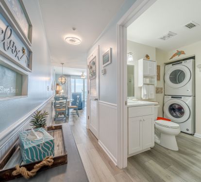 Hall bath showing washer dryer
