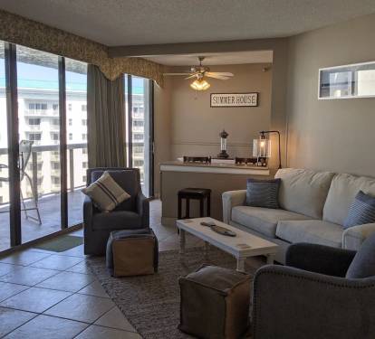 Living room looking into kitchen bar seating area