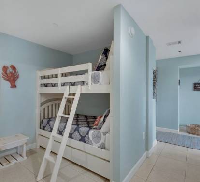The bunk nook is away from the main living area. Below is also a trundle bed.