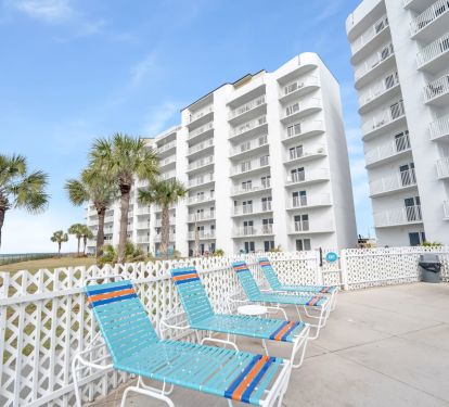Exterior view from pool area. Tables and loungers available for use.