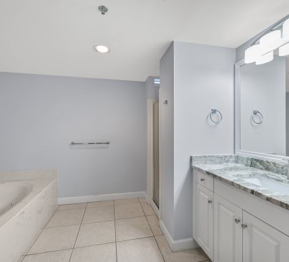 En Suite Bath for 2nd Master.  Has Jacuzzi and larger Shower.  New Granite