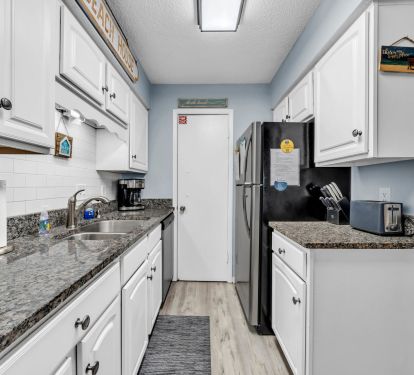 Galley kitchen with everything you need for cooking meals in!