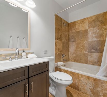 Second-floor King Suite 2- ensuite bath features a large soaking tub with a shower