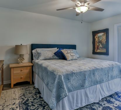 First floor en suite bedroom with door to pool and outdoor kitchen areas