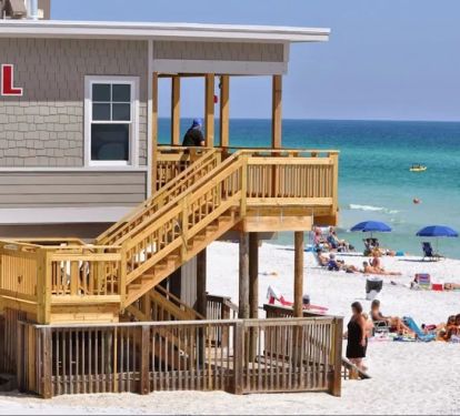 Whale's Tail bar and restaurant is on the beach to the right of Majestic Sun