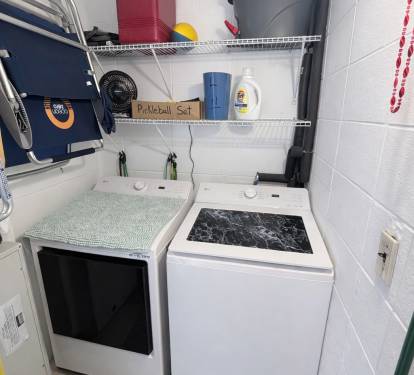 Utility room with new LG washer and dryer. 