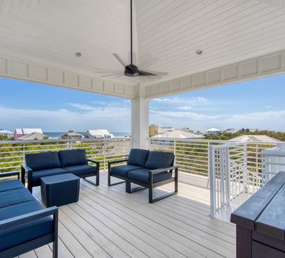 The covered 3rd floor viewing deck has an outdoor living room and gulf views
