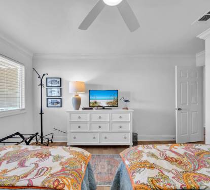 This is the first guest bedroom as you walk in the unit and has a private bath