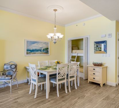 Large dining table and stacked bunk for additional guests.