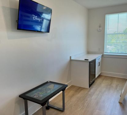 SmartTV for streaming Disney+, Hulu LiveTV, Netflix, Infinity Game Table, from Arcade1Up, featuring digital versions of classic board games, including Monopoly, Scrabble, Yahtzee, chess, checkers, digital coloring, puzzles, card games.