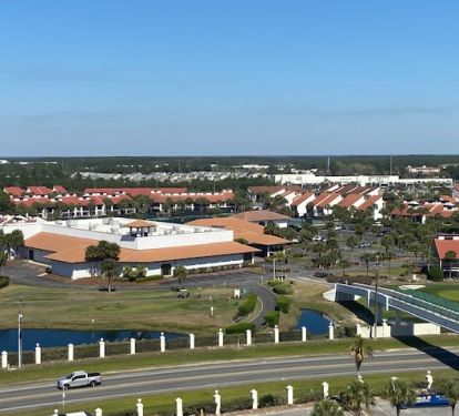 view from condo of walking bridge from beach side to golf course / villas area 