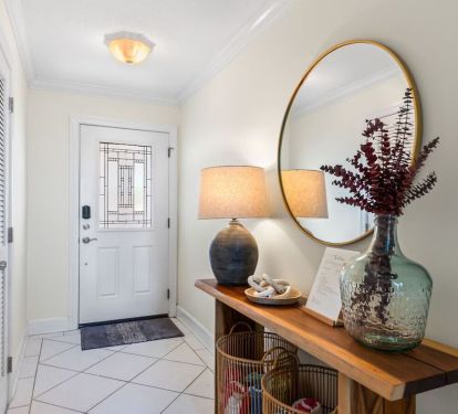 Welcome to Seabreeze Villa This coastal-inspired entryway sets the tone with natural wood accents, soft lighting, and thoughtful decor&mdash;inviting you to unwind and feel right at home. âœ¨