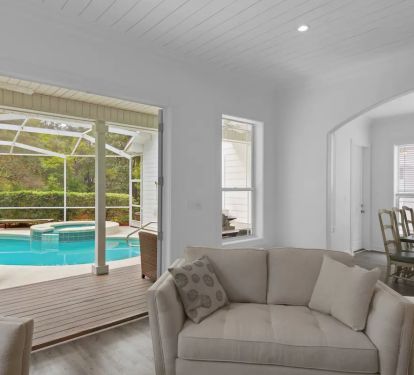 Vibe-4 Open the French doors to allow the screened outdoor dining area and pool/hottub to flow into the home.