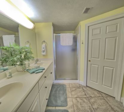 MASTERBATH FEATURES WALKIN SHOWER WITH TWO SHOWER HEADS AND TWO SINKS