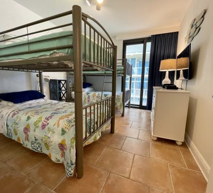 Two sets of adult size twin bunk beds with reading lights &amp; handy plugs.  